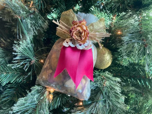 Avarado created potpourri by drying last summer's flower petals and placing them inside an inexpensive organza bag. She added a dried rose, a small ribbon and a few drops of fragrant essential oil to make a thoughtful hostess gift.