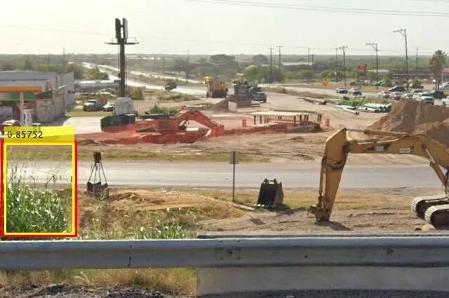 Red and yellow rectangles mark johnsongrass in an image of a construction site