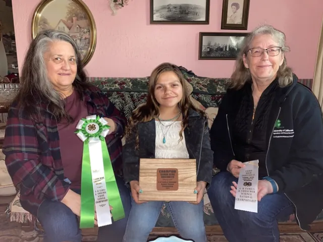 Allie, Lily and Teri holding the Championship ribbon, jewelry box and third place ribbon