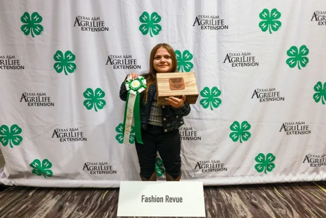 Lily with her ribbon and jewelry box awards for Overall Champion of National Fashion Revue