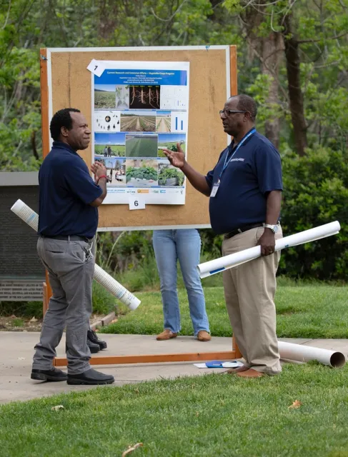 Two males have a conversation.