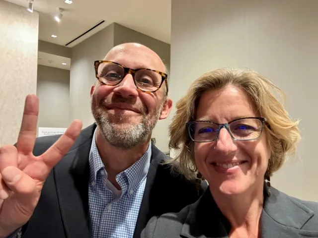 Ryan, on left, makes a peace sign.