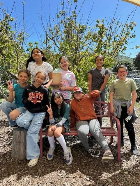 Student Leaders with a school garden lettuce harvest