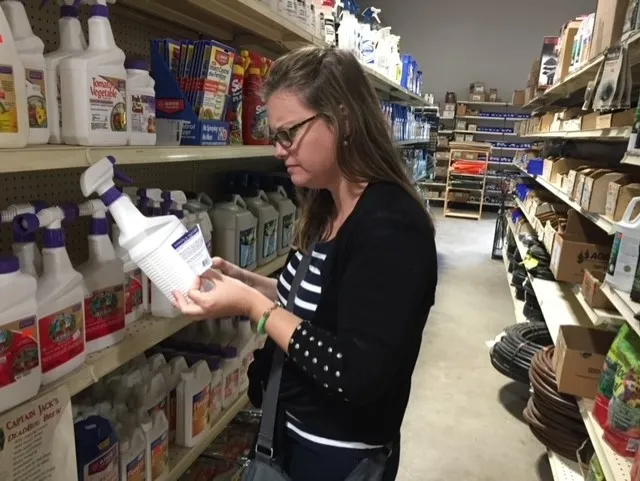 Reading a pesticide label, by Natalie Schellman.