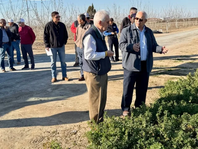 Khaled Bali, right, described to Costa his research on irrigation water management techniques, including groundwater recharge.