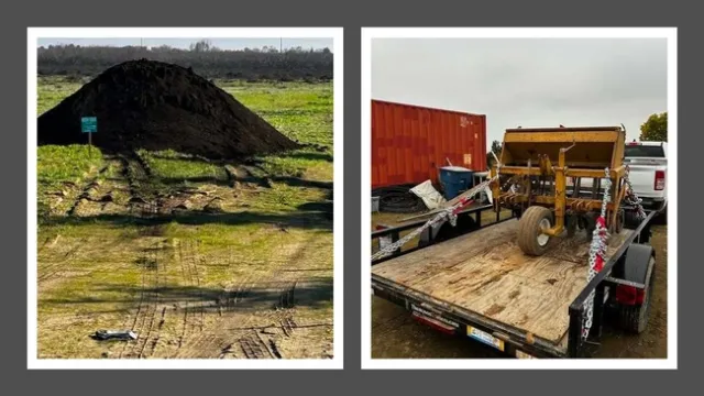 A pile of compost and a crop seeder on a trailer