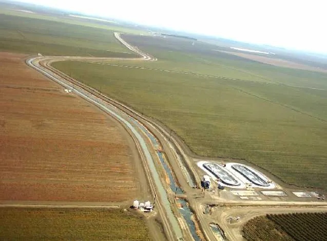 Irrigation drainage ditch tomatos and grapes Merced County
