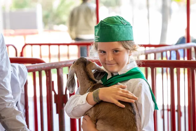 youth member holding her goat