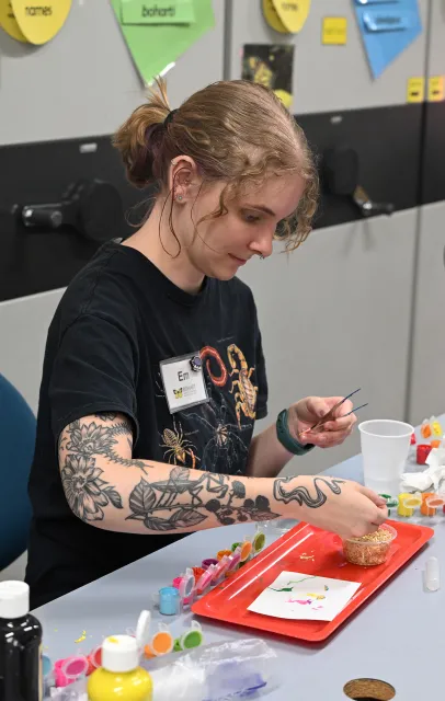 Doctoral candidate Emma "Em" Jochim of the Jason Bond lab led the maggot art process. She specializes in spiders in her research. (Photo by Kathy Keatley Garvey)