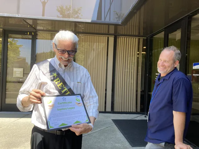 Lopez, left, shows UC Cooperative Extension entomology advisor Andrew Sutherland the certificate of appreciation from First 5 staff that says, “Your work has left a lasting legacy.”