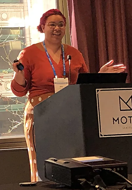 UC Davis doctoral student Iris Quayle delivering her prize-winning presentation.