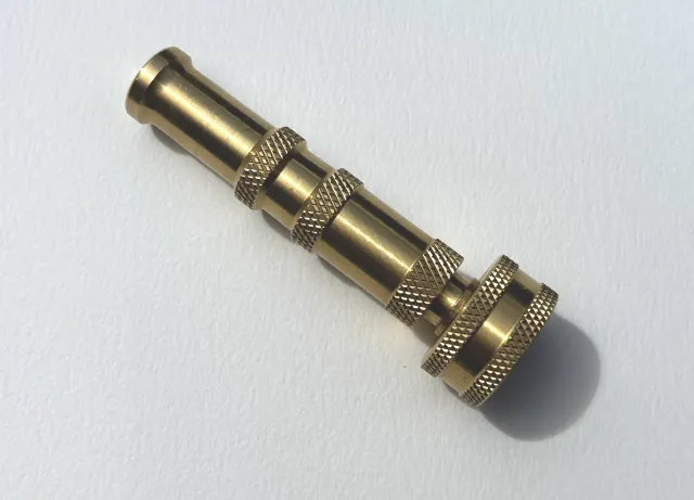 A brass, twistable hose nozzle.