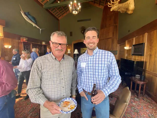 Steve Fennimore, left, smiles as he stands next to Austin Bowie