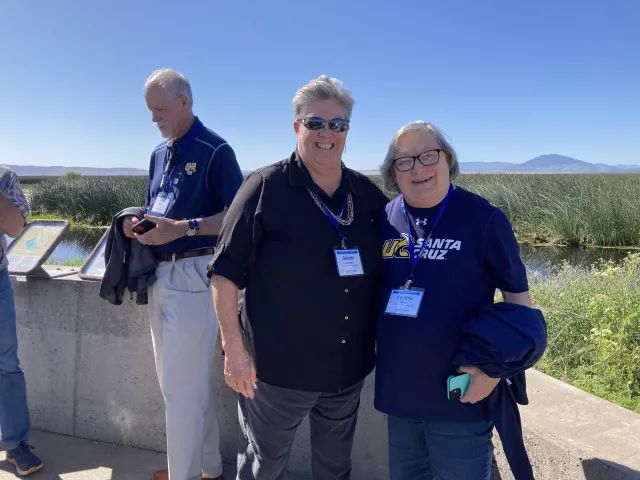 Glenda Humiston and Cynthia Larive with wildlife refuge wetlands in background