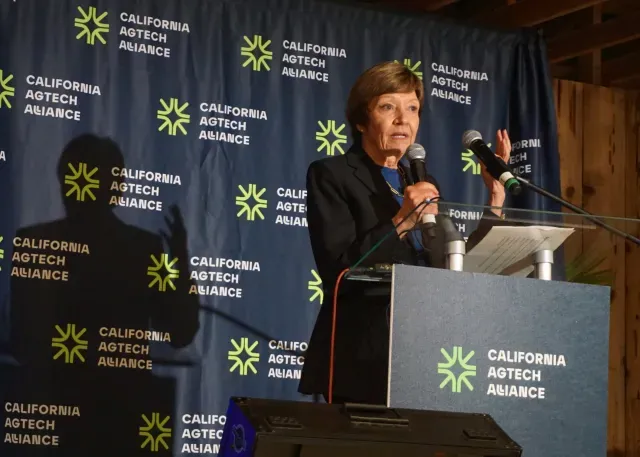 Karen Ross speaks at lecturn