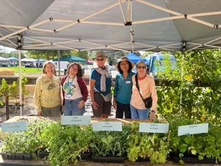 Caption: UC Master Gardener volunteers helped residents plant portable container gardens at the event that they could take home.