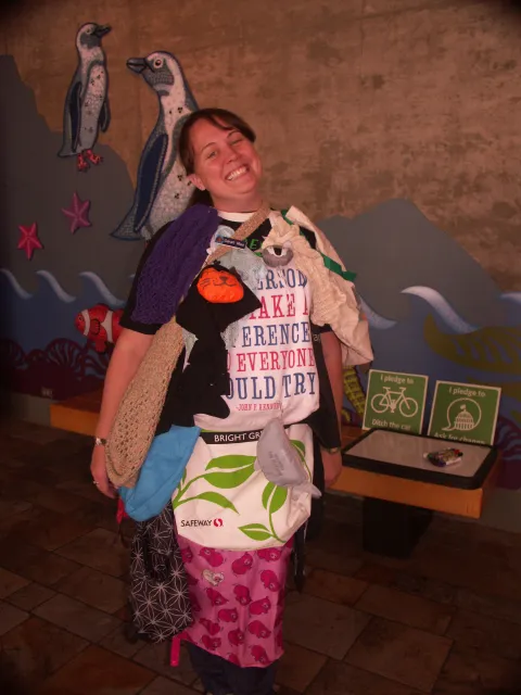 A woman dresses as a "Reusable Bag Lady", wearing a costume of reusable bags