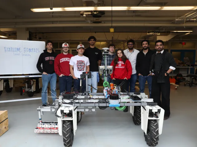 Rootline Robotics of Cornell University pose with their wheeled robotic tool
