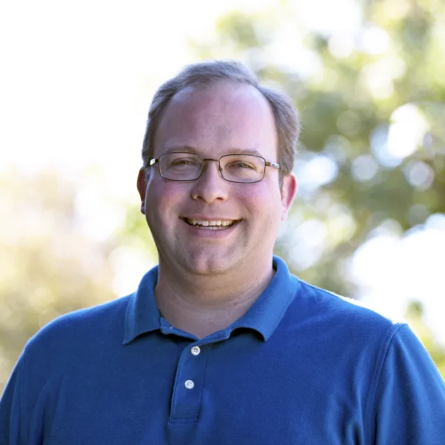 A headshot of Steve Worker smiling
