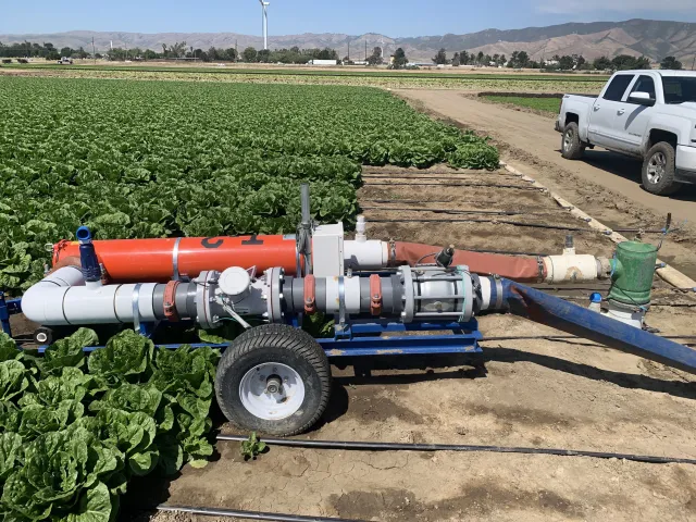 Drip irrigation trailer combining filtration, pressure regulation, flow measurement and sensors with automated reporting to CropManage application