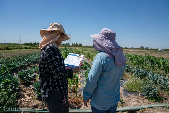 UC SFN Community Education Specialist performs outreach at a farm in Stanislaus County