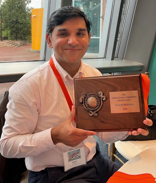 UC Davis nematology professor Shahid Siddique with the Excellence in Teaching Award, from the international Society of Nematologists.