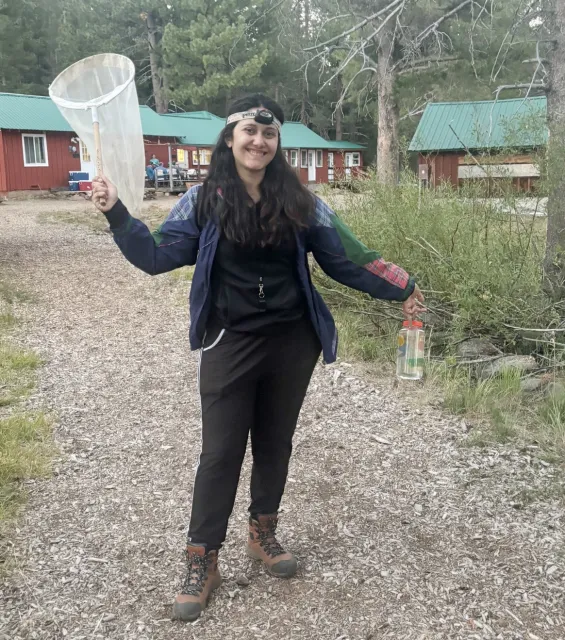 CC Edwards in the field, with insect net