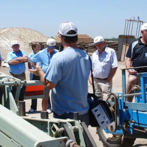 Giacomazzi (with back to camera) speaks to Australian visitors.