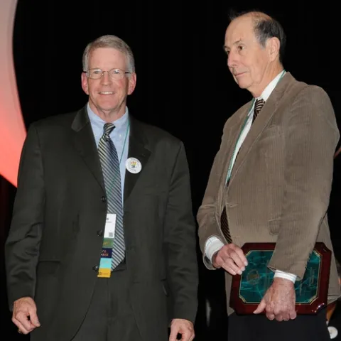 NEWLY INDUCTED FELLOW Bruce Hammock (right), distinguished professor of entomology at the University of California, Davis, with ESA president Dave Hogg of the University of Wisconsin. (Photo by Kathy Keatley Garvey)