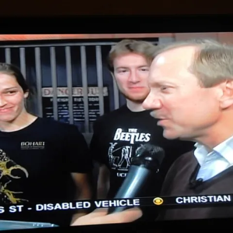 UC DAVIS Department of Entomology faculty member Larry Godfrey (right) answers questions about bugs. Behind him are Meredith Cenzer and Matan Shelomi. (Photo of Good Day Sacramento TV screen by Kathy Keatley Garvey)
