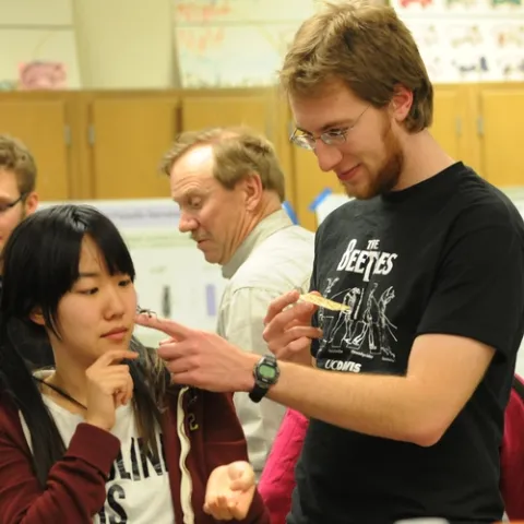 SARAH HAN, who works in the Greg Lanzaro lab at UC Davis and plans to enter entomology graduate school, meets a thorny walking stick from Borneo. With her is UC Davis entomology graduate student Matan Shelomi, who studies with major professor Lynn Kimsey, director of the Bohart Museum of Entomology. (Photo by Kathy Keatley Garvey)