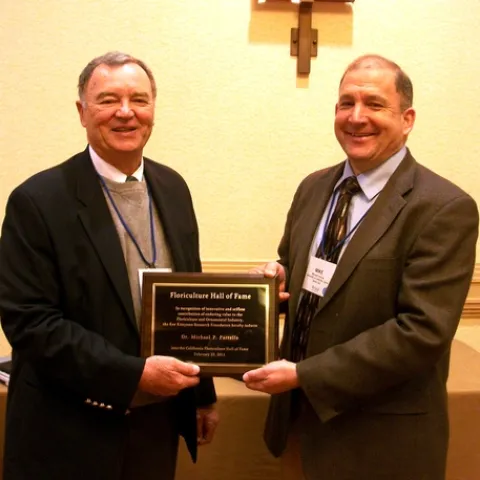 HALL OF FAME--Michael Parrella (right), professor and chair of the UC Davis Department of Entomology, was inducted into the California Floriculture Hall of Fame on Feb. 25 in San Diego. With him is presenter Mike Mellano Sr., of Mellano & Company, Oceanside. Mellano was inducted into the Floriculture Hall of Fame in 1990. (Photo Courtesy of Debi Aker)