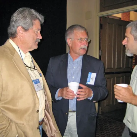 CASI executive board member Ron Harben (left) and UC Cooperative Extension cropping systems specialist Jeff Mitchell (center) speak with Paul Hicks of Catholic Relief Services during a break at the Water for Food Conference.