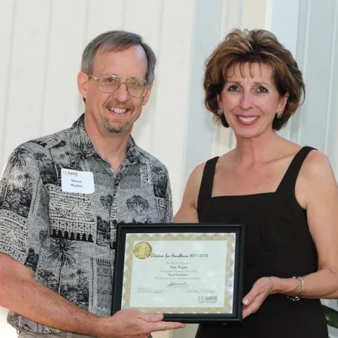 Bohart senior museum scientist Steve Heydon with Chancellor Linda Katehi. (Photo by Kathy Keatley Garvey)
