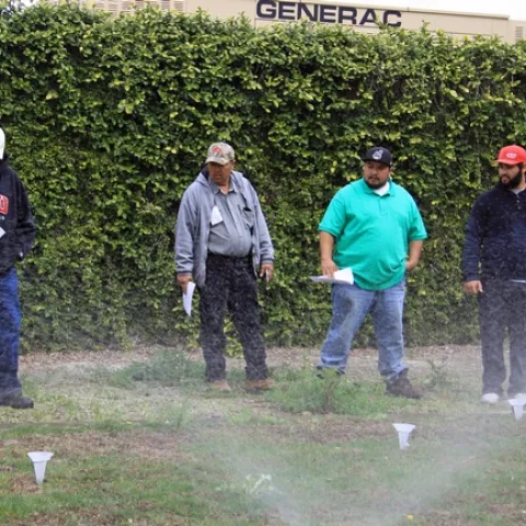 Green Gardener training participants conduct a sprinkler test.