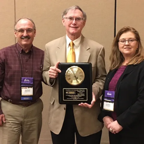 Gene Brandi (left), president of the American Beekeeping Federation and Joan Gunter, president of the Foundation for the Preservation of Honey Bees, with Founders' Award recipient Eric Mussen.