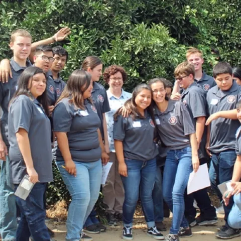 Woodlake High School student pose with Beth Grafton-Cardwell at the UC Lindcove Research and Extension Center near Exeter.