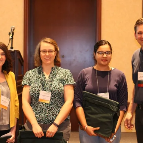 CWSS Student Poster Winners. Pictured from Left to Right: Katie Driver, HannahJoy Kennedy, Priyanka Chaudhari, and CWSS Director/Student Liaison Scott Oneto. Photo by: Gil Del Rosario
