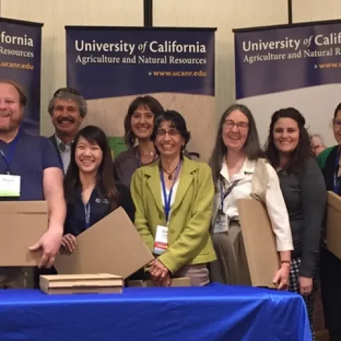 The Youth Retention Study Team won the Outstanding Research award. From left, John Borba, Chris Greer, Russ Hill, Mark Bell, Car Mun Kok, JoLynn Miller, Dorina Espinoza, Marianne Bird, Kendra Lewis, Claudia Diaz-Carrasco, and Wendy Powers.