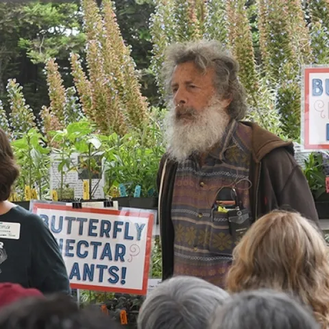 Tora Rocha, founder of the Pollinator Posse, based in Oakland, introduces UC Davis distinguished professor Art Shapiro. Rocha also delivered a presentation. (Photo by Kathy Keatley Garvey)