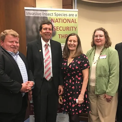 The panel gathers for a group photo following the congressional briefing. From left are Faith Oi, University of Florida; Lee Van Wychen, Weed Science Society of America; moderator Frank Zalom of UC Davis Department of Entomology and Nematology and a past president of the Entomological Society of America; Paula Shrewsbury of the University of Maryland; Kelley Tilmon of Ohio State University; and Dave Chun, chief of staff for Rep. Tulsi Gabbert. (Photo by Chris Stelzig)