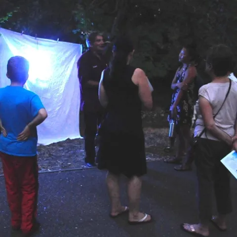 Standing in front of the blacklighting, Bohart associate Greg Kareofelas talks to moth enthusiasts at the 2017 Bohart Museum of Entomology Moth Night. (Photo by Kathy Keatley Garvey)