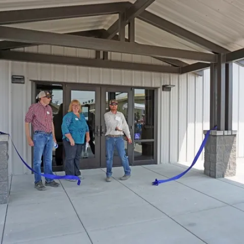 Left to right, UC ANR vice provost Mark Lagrimini, associate vice president Wendy Powers, and IREC director Rob Wilson took part in the ribbon cutting ceremony for the new IREC Multi-purpose Conference and Laboratory Building.