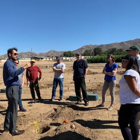 Amir Haghverdi showing plots to EarthWatch, UCCE and CBWCD teams