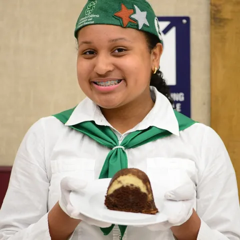 Celeste Harrison with her prize-winning chocoflan dessert. (Photo by Kathy Keatley Garvey)