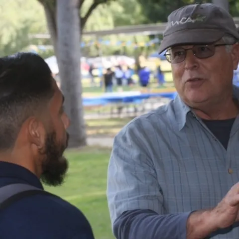 UCCE horticulture advisor Don Hodel, right, said fig trees at El Pueblo de Los Angeles Historical Monument become unhealthy when the ground beneath the canopy was covered with concrete, preventing fallen leaves from decomposing and enriching the soil.