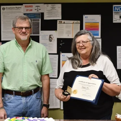 Director Jeff Dahlberg thanks Diana Nix at her celebration.