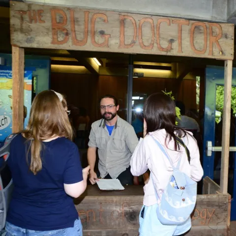 Doctoral candidate Brendon Boudinot answers questions about insects in the Bug Doctor booth at Briggs Hall. (Photo by Kathy Keatley Garvey)