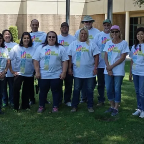 The Kearney walking team poses for a picture before setting out for a lunchtime walk on the center grounds.