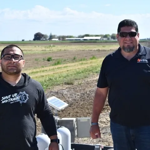 Moises Luna (left) of Agrivalley Company and Alex Flores of Yardney Water Filtration Systems visit the NRI Project field in Five Points, CA April 2, 2019